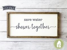 a sign that says save water, shower together on the side of a white wooden wall