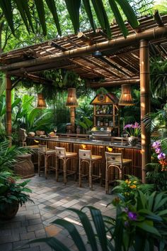 an outdoor bar surrounded by tropical plants and greenery