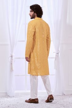 Honey yellow straight kurta with tonal chikankari embroidery highlighted with mirror like work. Comes with contrasting solid pyjama. - Aza Fashions Yellow Chanderi Sherwani With Chikankari Embroidery, Designer Yellow Sherwani With Dabka Work, Yellow Sherwani With Dabka Work For Designer Wear, Yellow Sherwani With Gota Work Straight Kurta, Yellow Sherwani With Gota Work In Straight Kurta Style, Yellow Sherwani With Gota Work And Straight Kurta Shape, Yellow Sherwani With Gota Work, Yellow Sherwani With Gota Work For Navratri, Festive Yellow Sherwani With Dabka Work