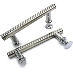 three stainless steel door handles on white background