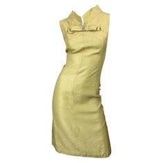 Chic 1960s I MAGNIN pale yellow silk shantung 60s shift dress! Features a bow at center collar encrusted with rhinestones. Tailored bodice with a forgiving shift skirt. Full metal zipper up the back with hook-and-eye closures. Very well made with heavy attention to details. Can easily be worn for any day or evening event. Perfect with sandals, wedges or flats for day, and heels for evening. In great condition Made in USA Approximately Size Medium Measurements: 36 inch bust 32 inch waist 41 inch Rounded Wardrobe, 60s Shift Dress, Silk Tank Dress, Long Halter Dress, Black Silk Dress, Designer Evening Dresses, Fresh Outfits, Yellow Silk, Empire Waist Dress