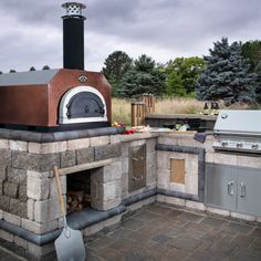 an outdoor pizza oven built into the side of a building