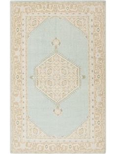 a light blue and beige rug with an intricate design