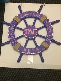 this is an image of a purple and white boat wheel with the word auburn on it