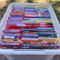 a plastic container filled with lots of different colored items