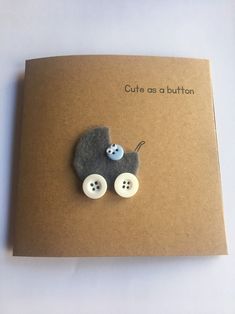 a card with buttons on it that says cute as a button in the shape of a baby carriage