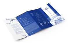 an open blue and white brochure on a white background