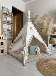 a white teepee with some decorations on it