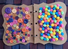 two pieces of crafting paper with buttons on them