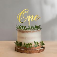 a cake with the word one on top