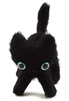 a black stuffed animal with blue eyes