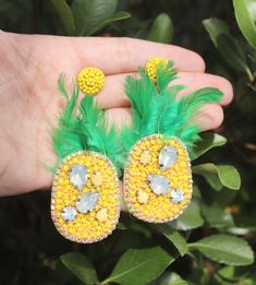 "These unique earrings are the perfect statement piece for any donut lover! Our unique, kitschy earrings feature gorgeous seed beading to look like a sprinkle donut in your choice of coloring! They also have a stunning, beaded round post. Choose your color at checkout! Measurements are approximately 2.25\"	is_active	18888049	Apparel & Accessories > Jewelry > Earrings	https://www.etsy.com/listing/810826230/beaded-donut-earrings-sprinkle-doughnut	jewelry > earrings > dangle_earring Summer Party Dangle Crystal Earrings, Summer Party Crystal Dangle Earrings, Yellow Fun Earrings For Party, Fun Green Beaded Earrings For Party, Fun Yellow Party Jewelry, Summer Crystal Dangle Earrings For Pierced Ears, Summer Crystal Dangle Earrings, Kitschy Earrings, Sprinkle Doughnut