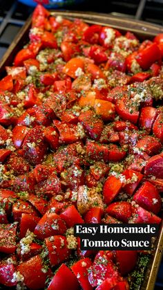 a tray filled with sliced up tomatoes covered in seasoning