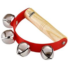 a red bracelet with bells on it and a wooden mallet sticking out of it