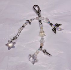 a key chain with charms and beads on it