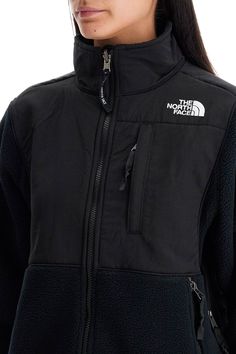 The North Face short sports jacket made of recycled fleece with inserts in recycled nylon canvas. High-neck model equipped with a closure and three zip pockets, adjustable hem with elastic drawstrings and underarm openings with zippers. Iconic TNF logo embroidered on the chest and back. Comfortable fit. The model is 177 cm tall and wears size XS. Composition: 100%R-PL, 100%R-PA Fleece Lined Windbreaker For Outdoor Activities, Fleece-lined Windbreaker For Outdoor Activities, Winter Outdoor Nylon Fleece Jacket, Nylon Fleece Jacket With Fleece Lining For Outdoor, Functional Fleece Outerwear For Cold Weather, Fall Nylon Fleece Jacket With Fleece Lining, Fall Nylon Fleece Jacket, Functional Winter Fleece Track Jacket, Functional Fleece Track Jacket For Winter