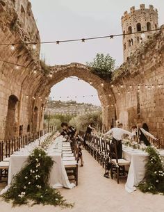 an instagram page with tables and chairs set up in front of stone archways