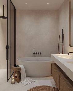 a bathroom with a large white tub next to a walk in shower