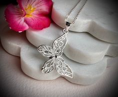 This a lovely necklace in 925 sterling silver with a cute Butterly as pendant hand crafted by us. Ideal as gift or for your fashion.  The chain is about 16" with an extended 2 more inches in case you need 18" as size.  The pendant is about 30x38 mm.  925 hallmark tag. It comes in a gift package. We aim to dispatch our orders in 24 hours using free 48 hours delivery but if you need your item quicker there is an option on the checkout for next day delivery for only £ 3.50. Elegant Silver Butterfly Necklace In Sterling Silver, Delicate Silver Charm Necklace For Mom, Mother's Day Jewelry Pendant With Butterfly Charm, Mother's Day Jewelry With Butterfly Pendant, Mother's Day Butterfly Pendant Jewelry, Dainty Silver Butterfly Necklace For Wedding, Delicate Silver Charm Necklace For Mother's Day, Butterfly-shaped Sterling Silver Jewelry For Wedding, Elegant Silver Butterfly Necklace With Charm