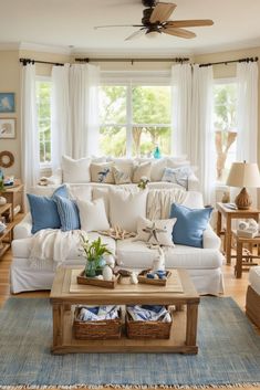 a living room filled with lots of furniture and pillows on top of a wooden table