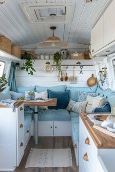 the interior of an rv with blue and white decor