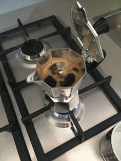 a stove top that has some kind of liquid on it and is being used as a burner