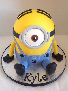 a cake that is shaped like a minion