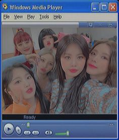 the windows media player is open to show several girls in front of a mirror with their faces