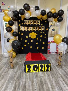 a graduation party with balloons and decorations