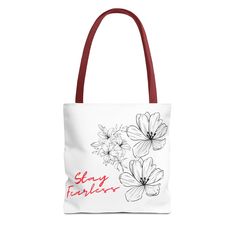 Elevate your style with our custom White Tote Bag featuring bold black stencil flowers and a vibrant red 'Stay Fearless' quote! These tote bags offer both functionality and flair. Crafted with spun polyester and double-stitched seams, they're built for durability. Made with 100% polyester, these medium-weight tote bags are perfect for everyday use. Upgrade your accessory game with our White Tote Bag and inspire fearlessness wherever you go. Order now and make a statement! Everyday Customizable Red Bags, Trendy Customizable Black Bags, Everyday Bags With Graphic Print, Customizable Daily Use Bags, Stencil Flowers, Red Floral Embroidered Tote Shoulder Bag, Black Stencil, White Flower-shaped Canvas Bag For Spring, White Graphic Print Tote Bag