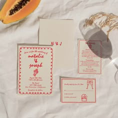 the wedding stationery is laid out on paper