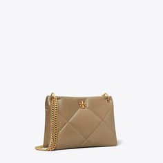 The Small Kira Diamond Quilt Satchel is irresistibly soft with blown-up diamond stitching. Pillowy dimension on a classic shape, punctuated by beveled Double T hardware. Wear the curb chain strap doubled over the shoulder or long and crossbody. Large Hobo Bag, Tory Burch Kira, Quilted Shoulder Bag, Chain Top, Womens Designer Handbags, Quilting Techniques, Designer Shoulder Bags, Diamond Quilt, Curb Chain