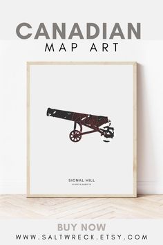 the canadian map art is displayed in front of a white wall with an old cannon on it