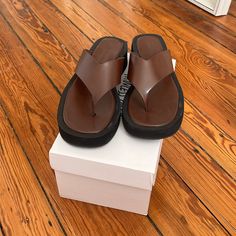 Princess Polly Platform Sandals In Brown. New Out Of The Box. Brown Flat Platform Sandals, Brown Synthetic Toe Post Flip Flops, Brown Synthetic Round Toe Flip Flops, Brown Synthetic Flat Heel Flip Flops, Brown Flat Flip Flops, Brown Synthetic Flip Flops, Brown Leather Flat Heel Flip Flops, Brown Synthetic Flat Flip Flops, Brown Toe Post Sandals With Cushioned Footbed