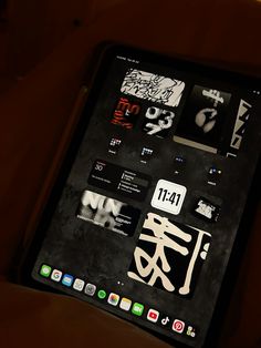 an ipad with chinese writing on the screen