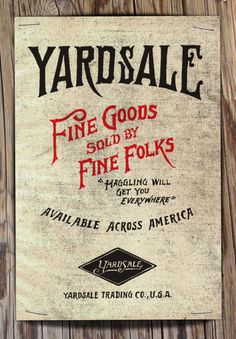 yard sale sign hanging on the side of a wooden fence with wood planks behind it