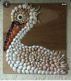 a bird made out of rocks and shells