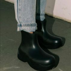 All Black Rubber Rain Boots Casual Black Platform Boots With Padded Ankle, Casual Rain Boots With Round Toe For Streetwear, Trendy Black Waterproof Boots, Casual Black Ankle-high Rain Boots, Trendy Black Platform Boots With Flat Heel, Black Ankle Rain Boots With Lug Sole, Trendy Black Waterproof Rain Boots, Casual Platform Boots With Pointed Toe, Casual Pointed Toe Platform Boots