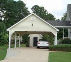 a white car parked in front of a house