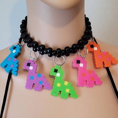 These kandi necklaces are made with pony beads and dinosaur charms. One size fits all. This Item adjust up to 17 Inches.  This Item is made to order. Perfect for any event! You will get lots of compliments in this unique wearable art! Stand out at your next event! Edm festival  Raves Party  Rave outfit  Festival outfit Pride Adjustable Multicolor Rave Choker, Rave Multicolor Choker For Festivals, Adjustable Rave Style Choker, Rave Style Multicolor Choker, Kandi Necklaces, Rave Necklace, Dino Necklace, Kandi Rave, Kandi Necklace