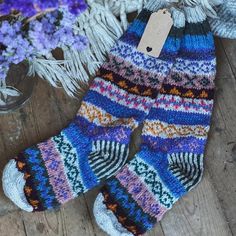 These thick and cosy fair isle pattern socks are hand knitted from 100% sheep wool, and produced by some very talented Nepalese women. Perfect for wearing around the house like slippers, and for pulling on under wellies.    Each item is beautifully handmade and free size. This design best fits a UK size 4-8. *These hand knitted socks do not have reinforced soles and are designed for wearing in bed and lounging. If you intend to be on your feet all day or on hard flooring, our hand felted slipper Motif Fair Isle, Fair Isle Socks, Women Crafts, Hand Knit Socks, Purple Hands, Knitted Socks, Pattern Socks, Felted Slippers, Fair Isle Pattern