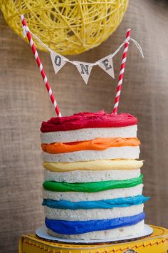 there is a cake that has been decorated with rainbow colors