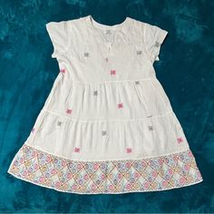 New With Tags, This Cute Dress Is Light And Flowy With Embroidered Details. White V-neck Dress With Geometric Embroidery, Casual Multicolor Embroidered V-neck Dress, Short Sleeve Embroidered Vacation Dress, Spring Cotton Dress With Geometric Embroidery, Casual Cotton Dresses With Geometric Embroidery, Cotton Dresses With Geometric Embroidery For Vacation, Casual Embroidered Dress With Geometric Patterns For Vacation, Casual Embroidered Dress For Beach, Casual V-neck Dress With Multicolor Embroidery