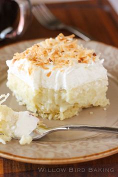 a piece of cake sitting on top of a plate with a fork next to it