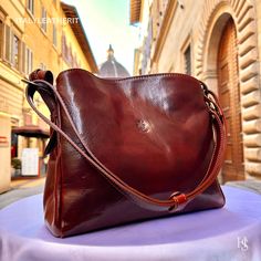 This bag has been made of the best genuine leather by local master crafters of Florence in Italy, designed for women who only accept premium Italian quality and luxury leather bags and modern Italian fashion. . Size: Width:30cm/11.811inch Height:24cm/9.4inch Depth: 10cm/3.9inch Color: Dark Brown . The Story Of this Bag: Once upon a time, there was a woman named Sarah who had recently lost her mother. The loss had left her feeling empty and she was struggling to cope with the pain. She missed her Classic Bags In Vegetable Tanned Leather As Gift, Italian Leather Bag As Gift, Italian Leather Bag As A Gift, New Mom Gift Basket, Italian Leather Purse, Italian Chic, Handmade Leather Bags, Holster Bag, Luxury Leather Bag