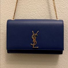 Excellent Condition, Rarely Used. Looks New, No Damage Or Scratches Inside Or Out. A Structured Silhouette Of Rich Grained Leather Adjustable Chain Shoulder Strap, 19" Drop 9.5"W X 6"H X 2"D Snap Flap Closure Goldtone Hardware One Inside Open Pocket Fully Lined Leather Dust Bag Included Blue Saint Laurent Bag, Bags Ysl, Ysl Handbags, Salvatore Ferragamo Handbags, Ferragamo Handbags, Medium Handbags, College Bags, Yves Saint Laurent Bags, Envelope Bag