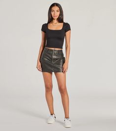 This cute and edgy faux leather mini skort features a flattering high-rise waist, form-hugging fit, and cargo side pockets that give this skort a functional flair. Fit & FeaturesFaux leather material, stretchy knit shorts liningHigh-rise waistSide flap pocketsFront snap-button and hidden zipper closureForm-hugging mini-length hemRuns true to size Fitted Faux Leather Mini Skirt Casual Style, Black Leather Mini Bottoms, Trendy Leather Mini Skirt, Fitted Faux Leather Mini Skirt, Edgy Style, Trendy Faux Leather Skort For Fall, Fitted Black Faux Leather Skort, Edgy High Waist Faux Leather Mini Skirt, Trendy Fitted Leather Mini Skirt, Trendy Faux Leather Mini Bottoms