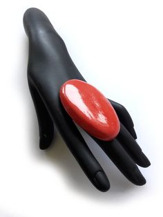 "Jumbo Red Ring, Huge Brutalist Ring, Large Red Gold Ring, Contemporary Ring, Bold Red Ring, Modern, Artisan, Handmade, Unique, Unusual, Handmade Jewelry, KEEP IT AWAY FROM hair spray, nail polish remover, and other chemicals. Can be washed with gentle soap. ADJUSTABLE FOR BIG SIZES Materials: Mixed Media, Brass Shank, Resin, 14K Gold Plating on Cabochon Measure approx.: 7.6 cm x 2.7 cm = 4.5\" x 1.8\" All parts are handmade. Each cabochon is slightly different. You are going to get random picke Large Ruby Ring, Unique Untreated Red Jewelry, Modern Handmade Red Ring, Modern Hallmarked Red Rings, Artisan Red Ring Jewelry, Red Rings, Contemporary Ring, Nail Polish Remover, Red Gold