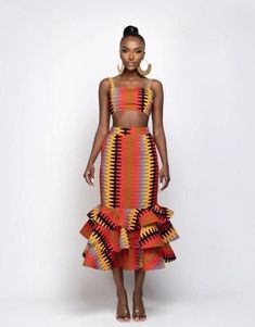 An African ankara print set made in Nigeria with love to show off the african fashion through versatility. Dress Poses, African Print Clothing, African Inspired Clothing, African Inspired Fashion, African Print Dress, African Print Dresses, African Print Fashion Dresses, African Fashion Women, African Clothing Styles