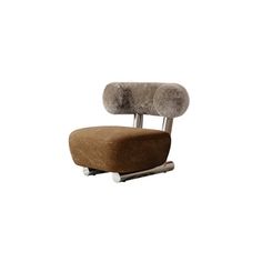 a brown chair with a furry seat pad on it's back and foot rest